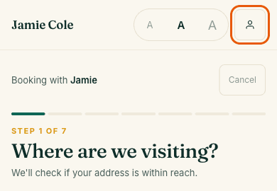 The top of a therapist's booking page on a phone, with the person icon at the top right circled