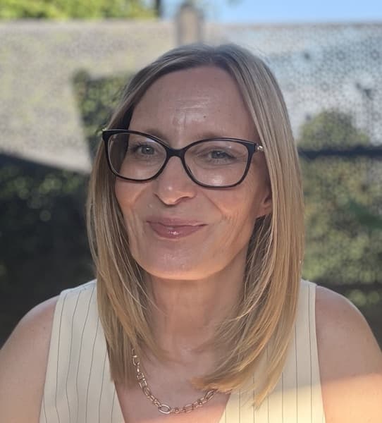Justine Coughlan smiling outdoors