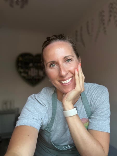 Nicola Fisher smiling in her treatment room
